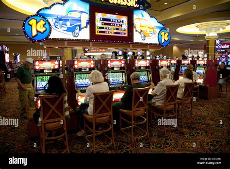 people playing slot machines.